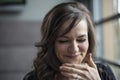 Portrait of Beautiful Young Woman with Brown Hair Laughing Royalty Free Stock Photo