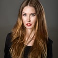 Portrait of beautiful young woman with brown hair and make-up Royalty Free Stock Photo