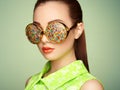 Portrait of beautiful young woman with colored glasses Royalty Free Stock Photo