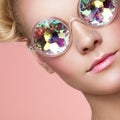 Portrait of beautiful young woman with colored glasses Royalty Free Stock Photo