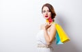 Portrait of beautiful young woman with colorful shopping bags on Royalty Free Stock Photo