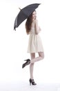 Portrait of beautiful young woman in dress with umbrella against white background Royalty Free Stock Photo