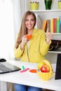 Portrait of a beautiful young woman drinking coffee