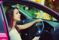 Portrait of beautiful young woman driver behind a wheel car Royalty Free Stock Photo