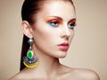 Portrait of beautiful young woman with earring. Jewelry and accessories Royalty Free Stock Photo