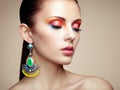 Portrait of beautiful young woman with earring. Jewelry and accessories Royalty Free Stock Photo