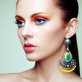 Portrait of beautiful young woman with earring. Jewelry and accessories Royalty Free Stock Photo