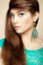 Portrait of beautiful young woman with earring. Jewelry and accessories Royalty Free Stock Photo