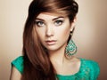 Portrait of beautiful young woman with earring. Jewelry and accessories Royalty Free Stock Photo