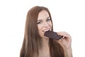 Portrait of a beautiful young woman eating a chocolate bar. Royalty Free Stock Photo