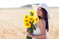 Portrait of a beautiful young woman in a field of wheat, which i Royalty Free Stock Photo