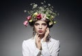 Portrait of beautiful young woman with flowers in hair Royalty Free Stock Photo