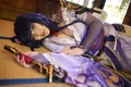 Portrait of a beautiful young woman game cosplay with samurai dress costume sleeping at japanese room Royalty Free Stock Photo