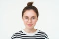 Portrait of beautiful young woman in glasses, wearing eyewear, smiling and looking happy, trying on new spectacles Royalty Free Stock Photo