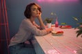 Portrait of a beautiful young woman having breakfast in a cafe Royalty Free Stock Photo