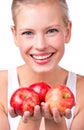 Apples to share. Portrait of a beautiful young woman holding apples in her hands.