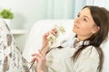 Portrait of beautiful young woman holding orchid flowers Royalty Free Stock Photo