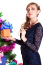 Portrait of a beautiful young woman holding a present near the C Royalty Free Stock Photo