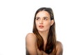 Portrait of a beautiful young woman. Long brown hair. Naked shoulders. Looking at side, posing. Royalty Free Stock Photo