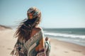 Portrait of beautiful young woman with long hair wearing scarf on the beach, A young Bohemian lady wearing boho style clothing on Royalty Free Stock Photo