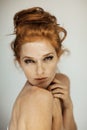 Portrait of a beautiful young woman with long red curly hair and freckles Royalty Free Stock Photo