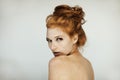 Portrait of a beautiful young woman with long red curly hair and freckles Royalty Free Stock Photo