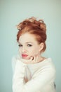 Portrait of a beautiful young woman with long red curly hair and perfect make up Royalty Free Stock Photo