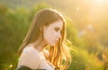 Portrait of beautiful young woman looking eways in summer park. Outdoor portrait of a cute girl. Happy cheerful female Royalty Free Stock Photo