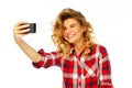 Portrait of a beautiful young woman making selfie on smart phone