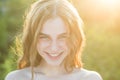 Portrait of beautiful young woman. Outdoor portrait of a cute girl. Happy cheerful female model, close up face. Teen Royalty Free Stock Photo