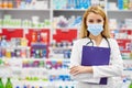 Portrait of beautiful young woman pharmacist at modern drugstore Royalty Free Stock Photo