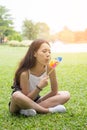 Portrait of beautiful young woman with pinwheel Royalty Free Stock Photo