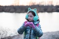 Portrait of beautiful young woman. Plein air photo shoot near river at winter Royalty Free Stock Photo