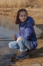 Portrait of beautiful young woman. Plein air photo shoot near river at winter. Portrait of a teenager. Girl 9 years old Royalty Free Stock Photo