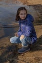 Portrait of beautiful young woman. Plein air photo shoot near river at winter. Portrait of a teenager. Girl 9 years old Royalty Free Stock Photo
