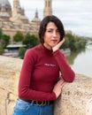 Portrait of a beautiful young woman posing next to the Basilica of Our Lady of the Pillar in Zaragoza, Spain Royalty Free Stock Photo