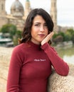 Portrait of beautiful young woman posing next to the Basilica of Our Lady of the Pillar in Zaragoza, Spain Royalty Free Stock Photo