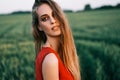 Portrait of beautiful young woman posing outdoors in summer sun Royalty Free Stock Photo