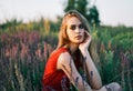 Portrait of beautiful young woman posing in sage field in summer sun Royalty Free Stock Photo