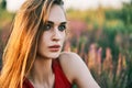 Portrait of beautiful young woman posing in sage field in summer sun Royalty Free Stock Photo