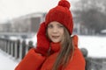 Portrait of a beautiful young woman in a red hat and coat Royalty Free Stock Photo