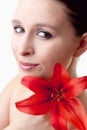Portrait of a Beautiful Young Woman with Red Lily Royalty Free Stock Photo