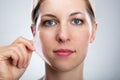 Woman Removing Peeling Mask From Her Face Royalty Free Stock Photo