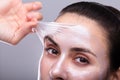 Woman Removing Peeling Mask From Her Face Royalty Free Stock Photo