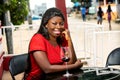 Portrait of a beautiful young woman in the restaurant with a gla Royalty Free Stock Photo