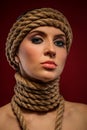 Portrait of a beautiful young woman with ropes Royalty Free Stock Photo