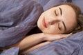 Portrait beautiful young woman sleeping while lying in her bed. Concept of pleasant and rest reinstatement for active life Royalty Free Stock Photo