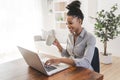 portrait of a beautiful young woman smiling and looking at laptop screen Royalty Free Stock Photo