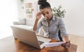 portrait of a beautiful young woman smiling and looking at laptop screen problem with billing Royalty Free Stock Photo