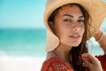 Fashion woman wearing straw hat at sea Royalty Free Stock Photo